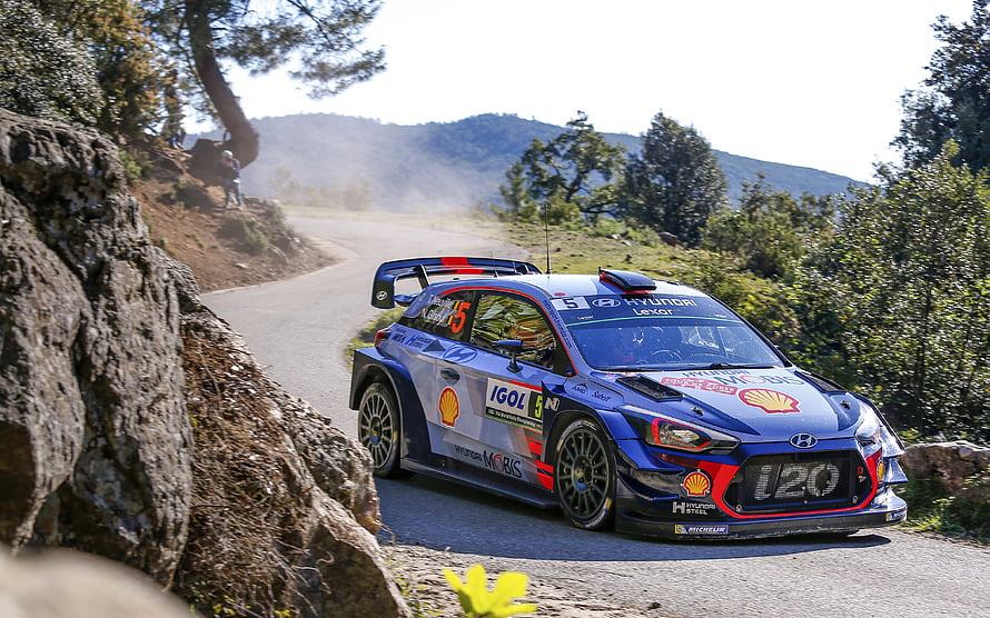Hyundai i20 WRC Rally Car Cornering on Mountain Road HD wallpaper