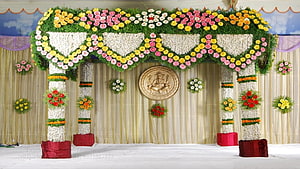 Traditional Indian Wedding Mandapam Stage Decorated With Colorful Fresh Flowers And Ganesha Emblem HD wallpaper
