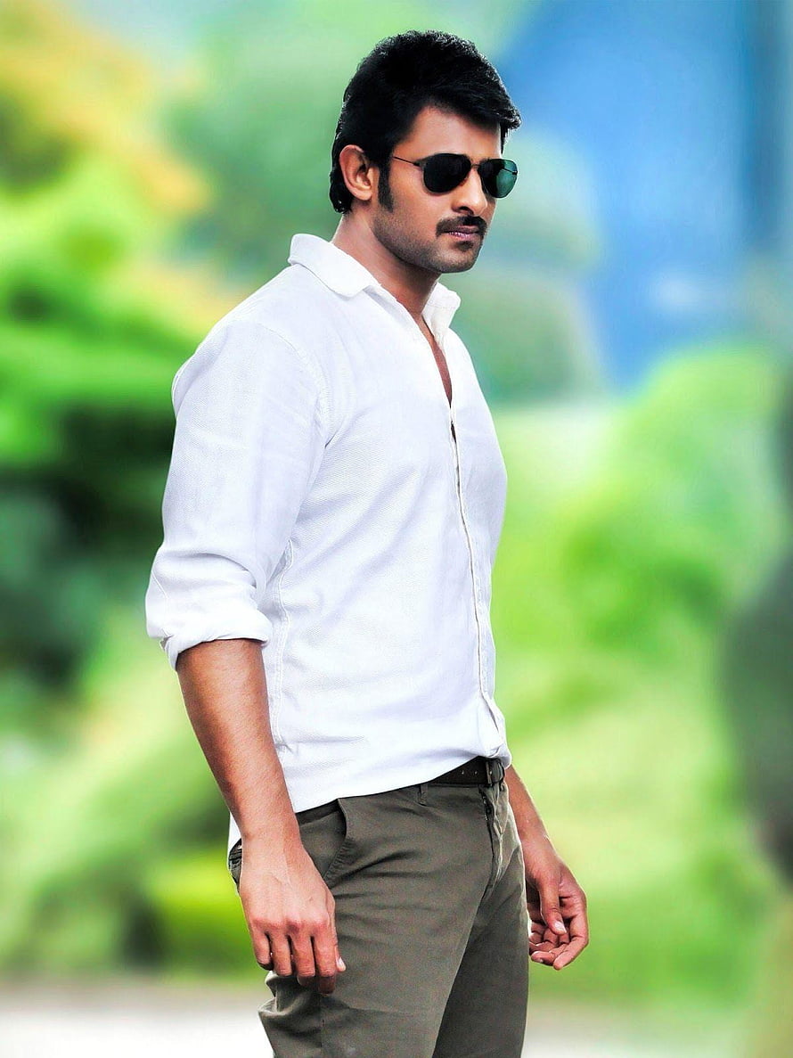 Prabhas in White Shirt and Sunglasses with Green Foliage Background HD phone wallpaper