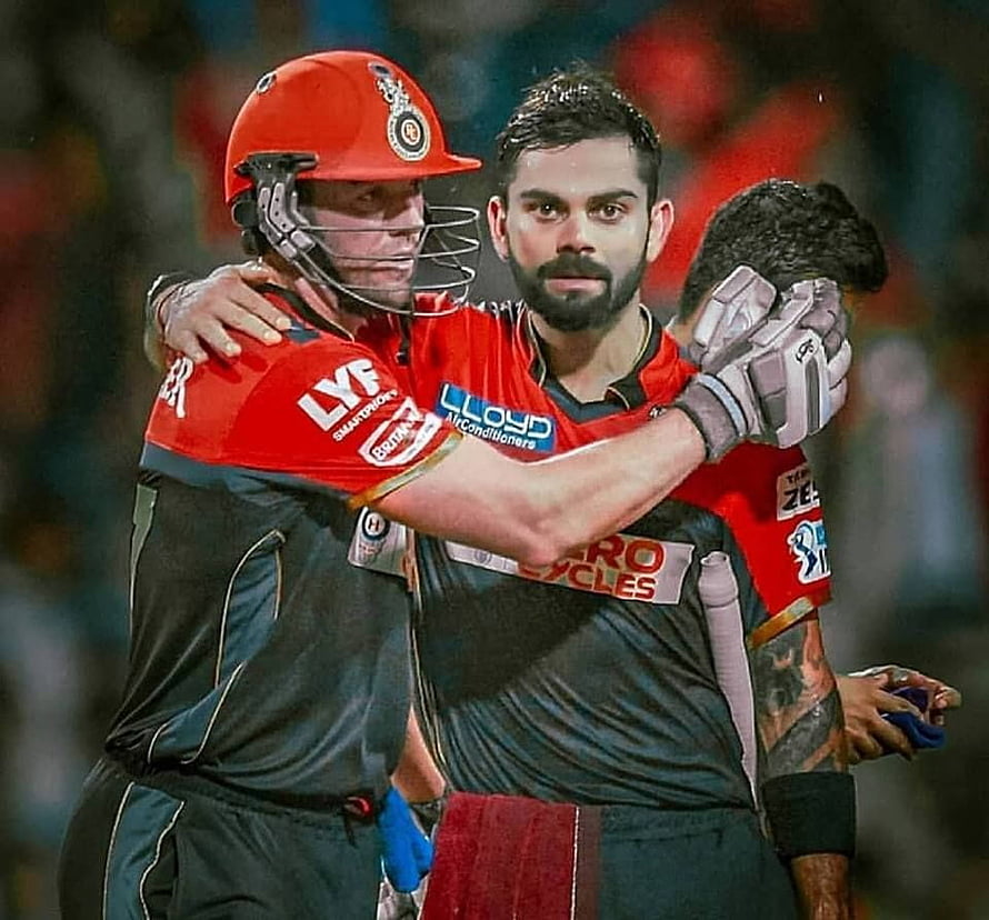 Virat Kohli and AB de Villiers Celebrating in RCB Red and Black Cricket Kits HD wallpaper