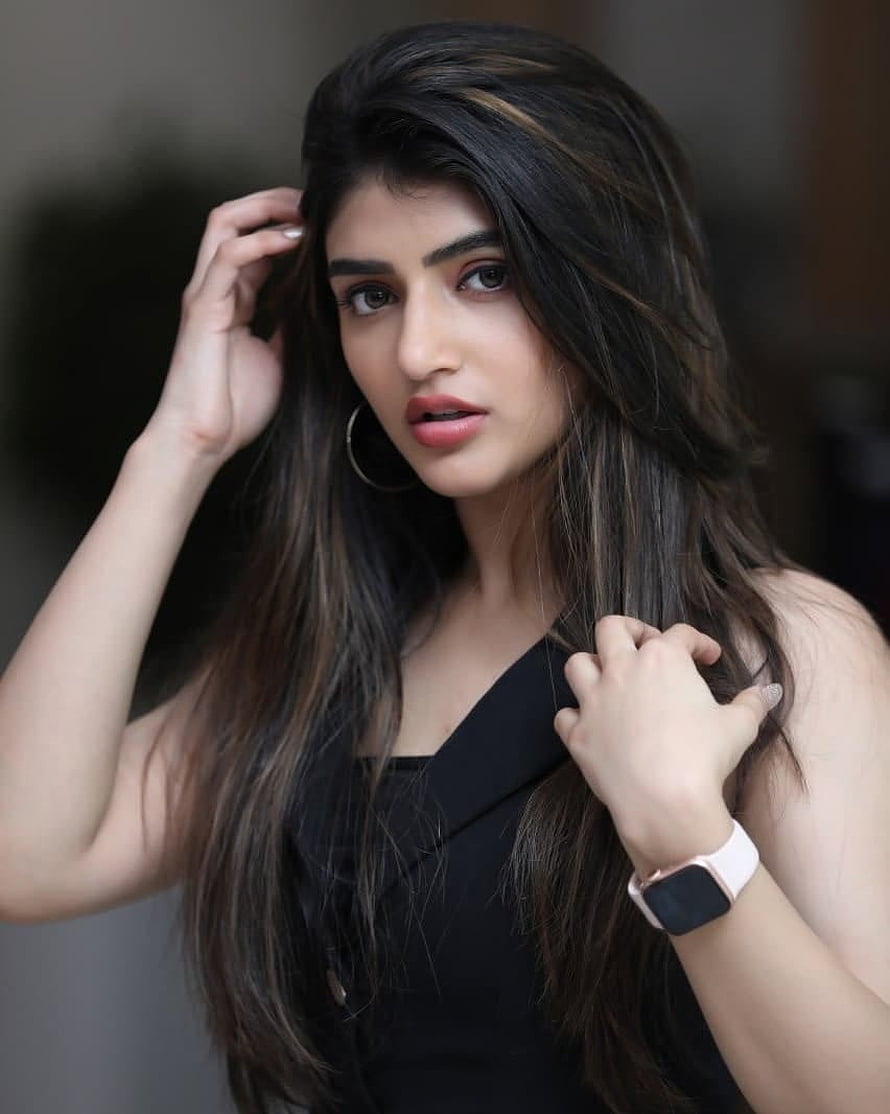 Sree Leela Portrait in Black Top with Long Dark Hair and Smartwatch HD phone wallpaper