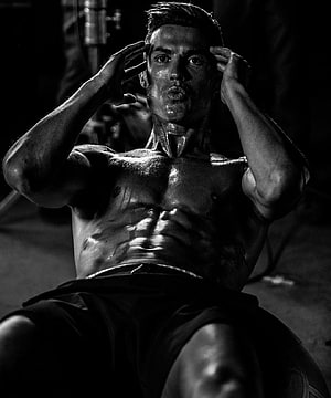 Cristiano Ronaldo Black and White Portrait Showing Defined Abs and Intense Expression HD phone wallpaper