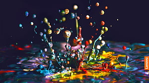 Vibrant Multicolored Paint Splash on Dark Background with Dynamic Liquid Drops HD wallpaper