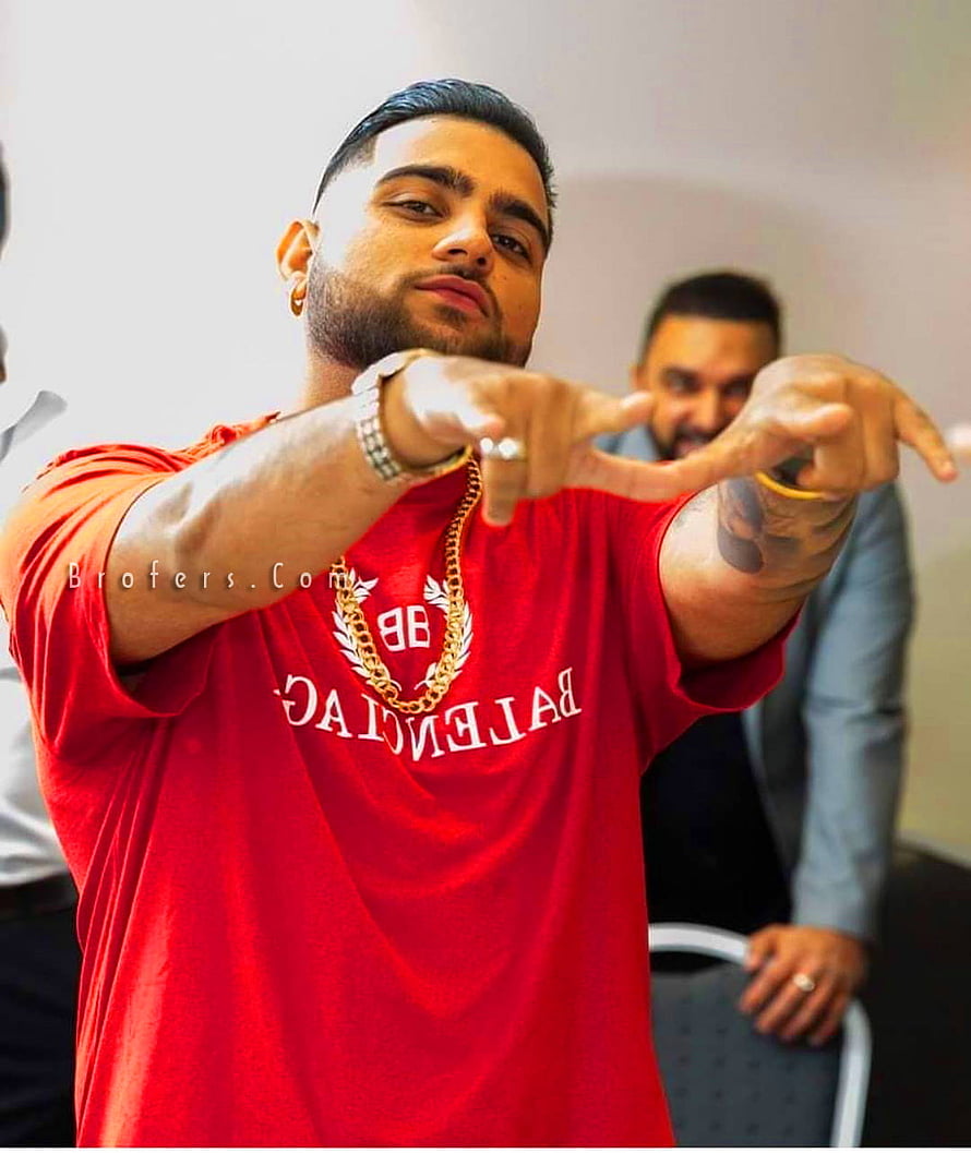 Karan Aujla in Red Balenciaga Tee Pointing Forward HD phone wallpaper