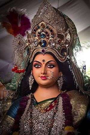 Maa Durga Murti in Ornate Gold Crown and Traditional Temple Attire HD phone wallpaper