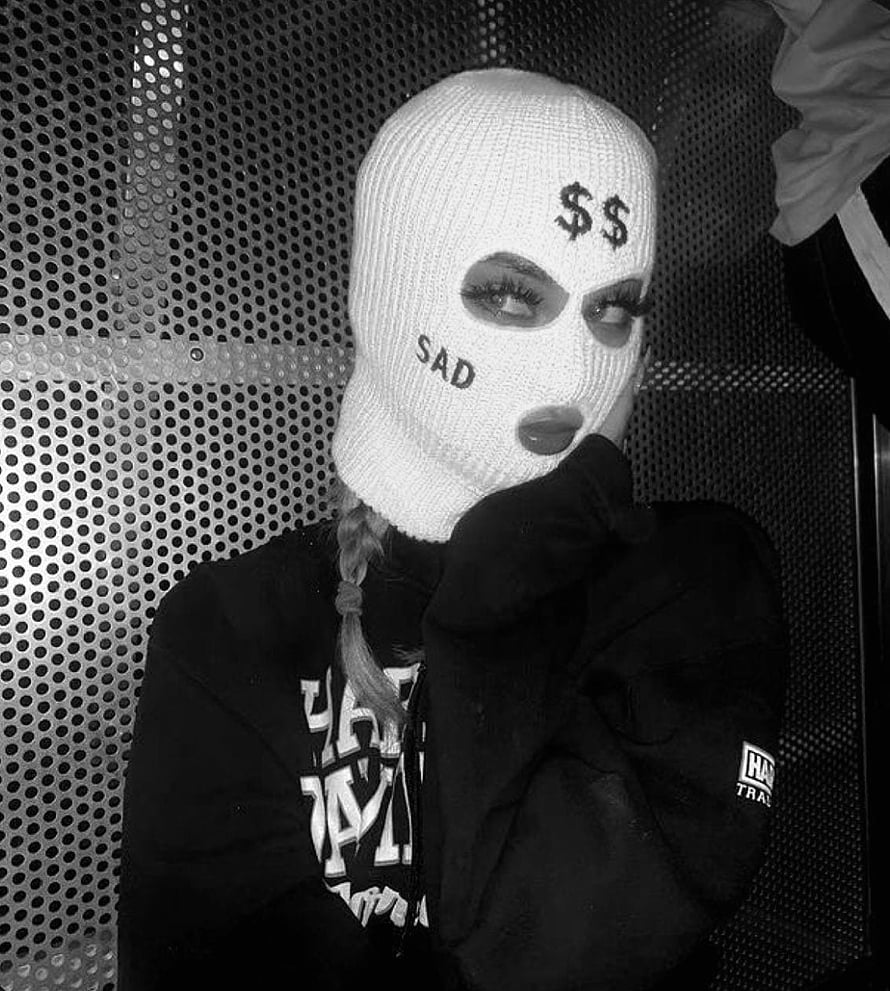 Black and white portrait of a woman wearing a white ski mask with embroidered text and dollar signs HD phone wallpaper