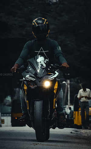 Rider on a Black and Yellow Royal Enfield Meteor 350 Motorcycle at Night HD phone wallpaper