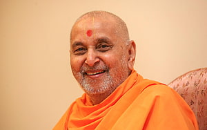 Portrait of HH Pramukh Swami Maharaj in Traditional Orange Saffron Robes HD wallpaper
