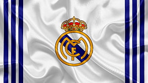 Real Madrid Club Crest on Flowing White and Blue Striped Fabric Background HD wallpaper