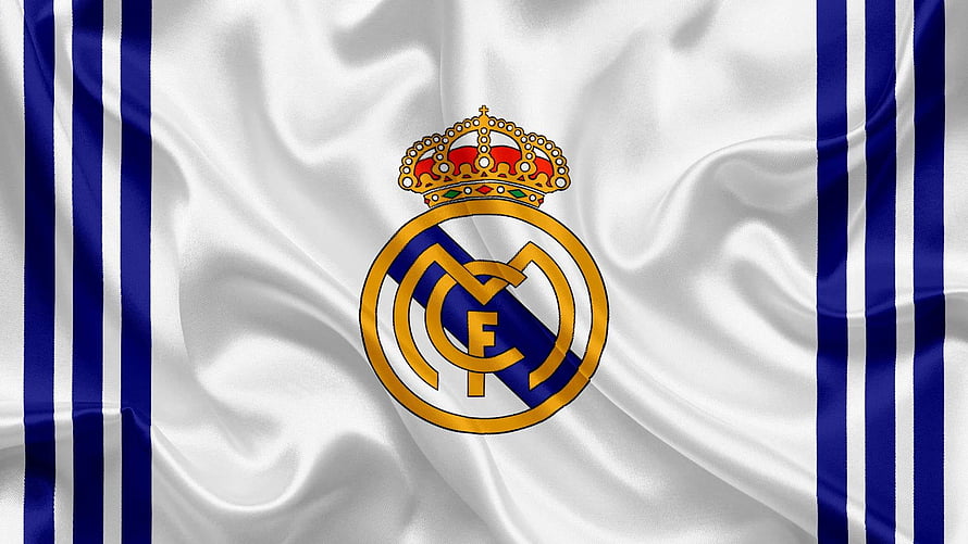 Real Madrid Club Crest on Flowing White and Blue Striped Fabric Background HD wallpaper