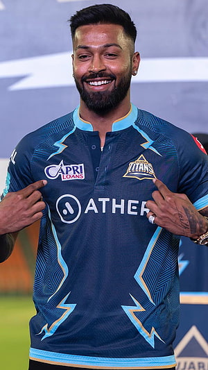 Hardik Pandya in the Gujarat Titans IPL jersey with Ather and Capri Loans sponsors HD phone wallpaper