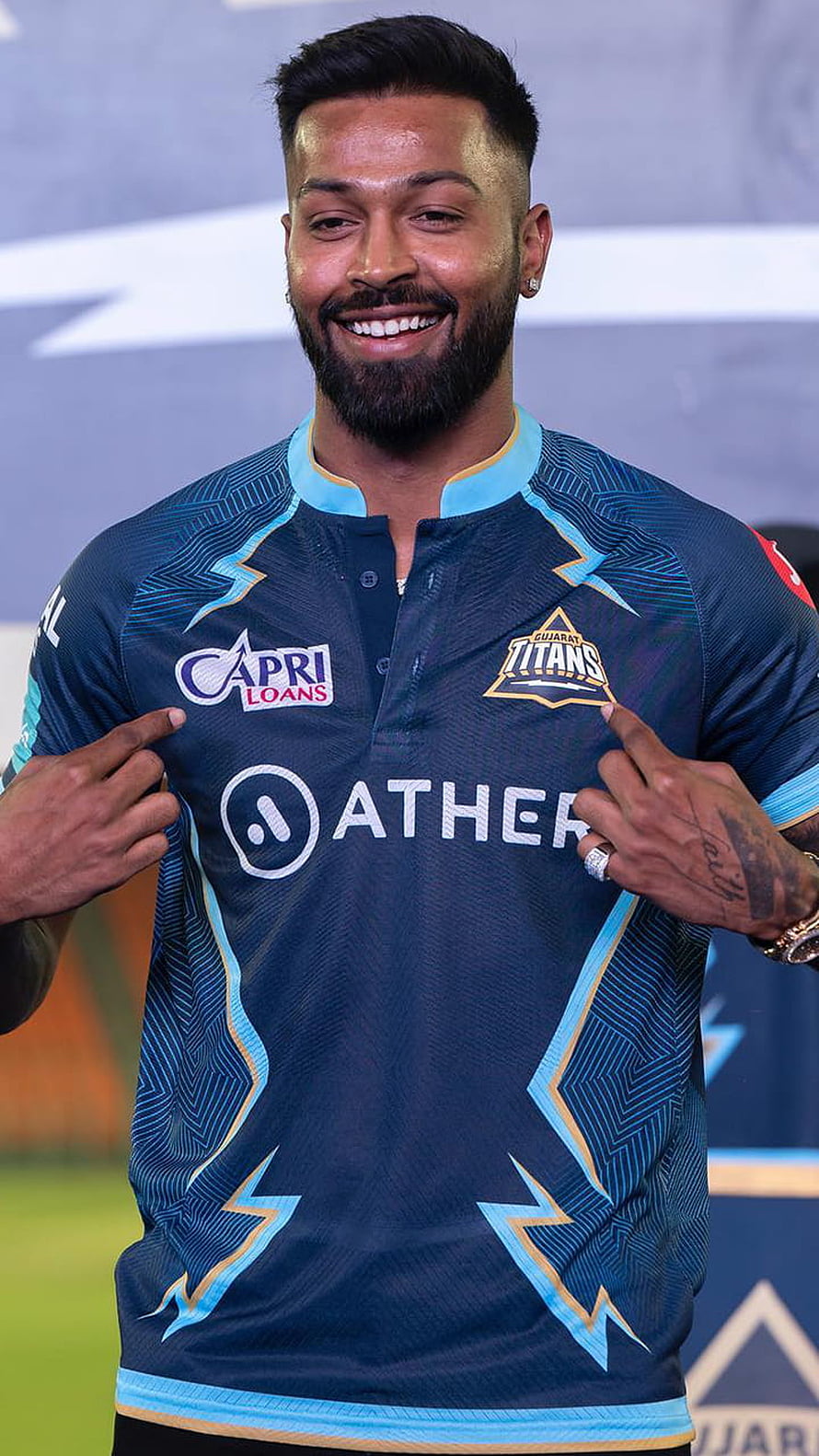 Hardik Pandya in the Gujarat Titans IPL jersey with Ather and Capri Loans sponsors HD phone wallpaper