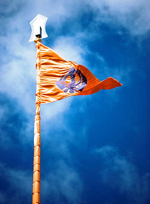 Sikh Khanda Flag Waving Against a Blue Sky with Clouds HD phone wallpaper