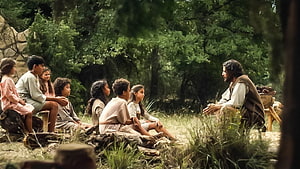 The Chosen Jesus Teaching Children in a Forest Setting HD wallpaper