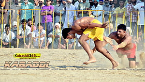 Kabaddi Match Action: Athlete in Yellow Shorts Leaping Over Defender in Dusty Arena HD wallpaper