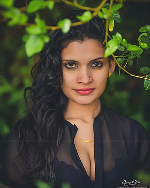 Reshmi Nair Portrait Under Green Foliage Wearing Black Sheer Top HD phone wallpaper