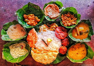 Traditional Odia Nuakhai Pitha Platter Served on Fresh Banana Leaves HD wallpaper