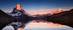 Matterhorn Peak at Sunrise with Perfect Reflection in Lake Riffelsee, Zermatt Switzerland HD wallpaper