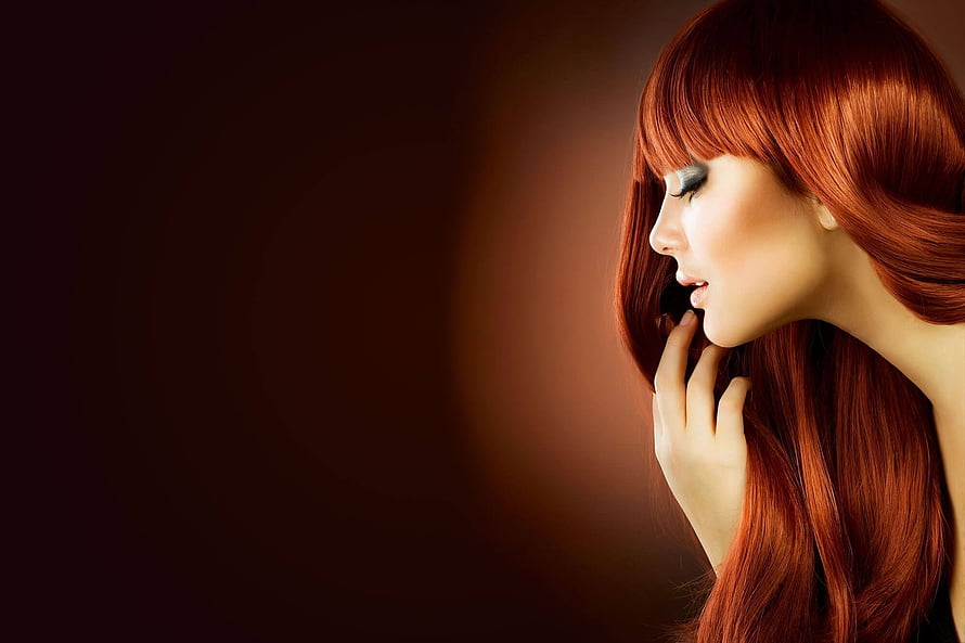 Elegant Redhead Woman Profile Portrait with Dramatic Makeup and Warm Studio Lighting HD wallpaper