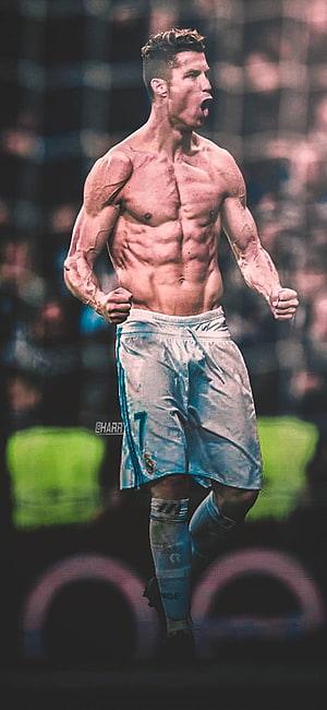 Cristiano Ronaldo shirtless celebration in Real Madrid kit with intense stadium backdrop HD phone wallpaper