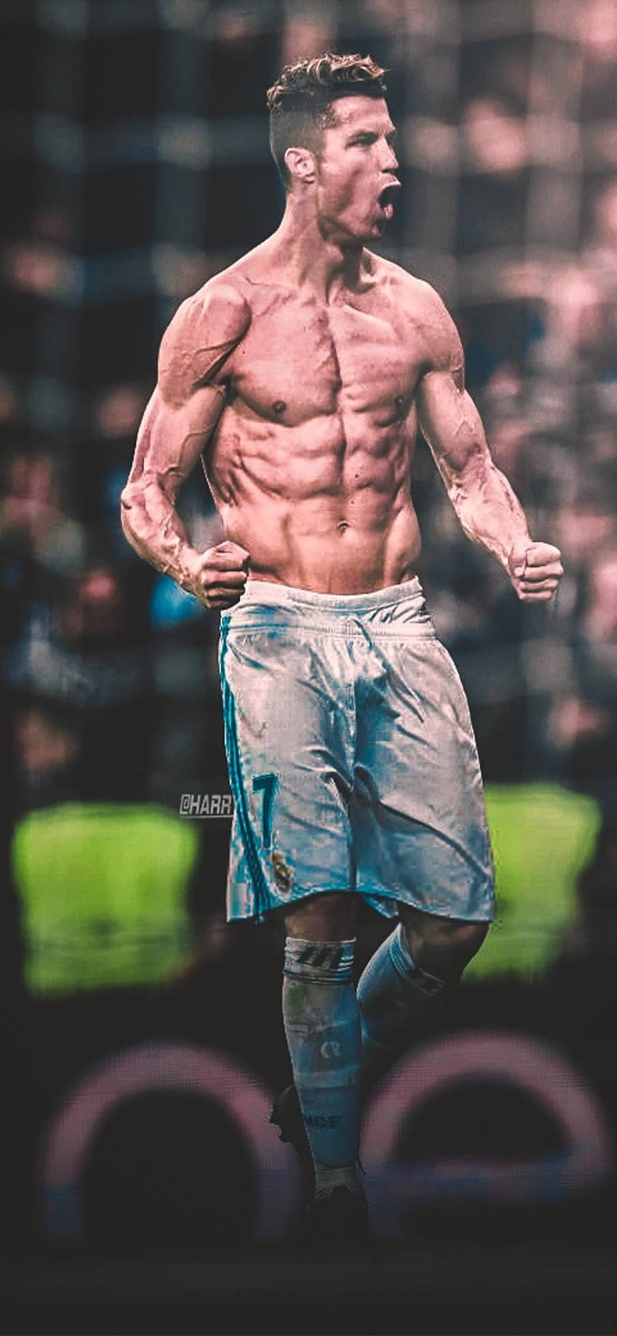 Cristiano Ronaldo shirtless celebration in Real Madrid kit with intense stadium backdrop HD phone wallpaper