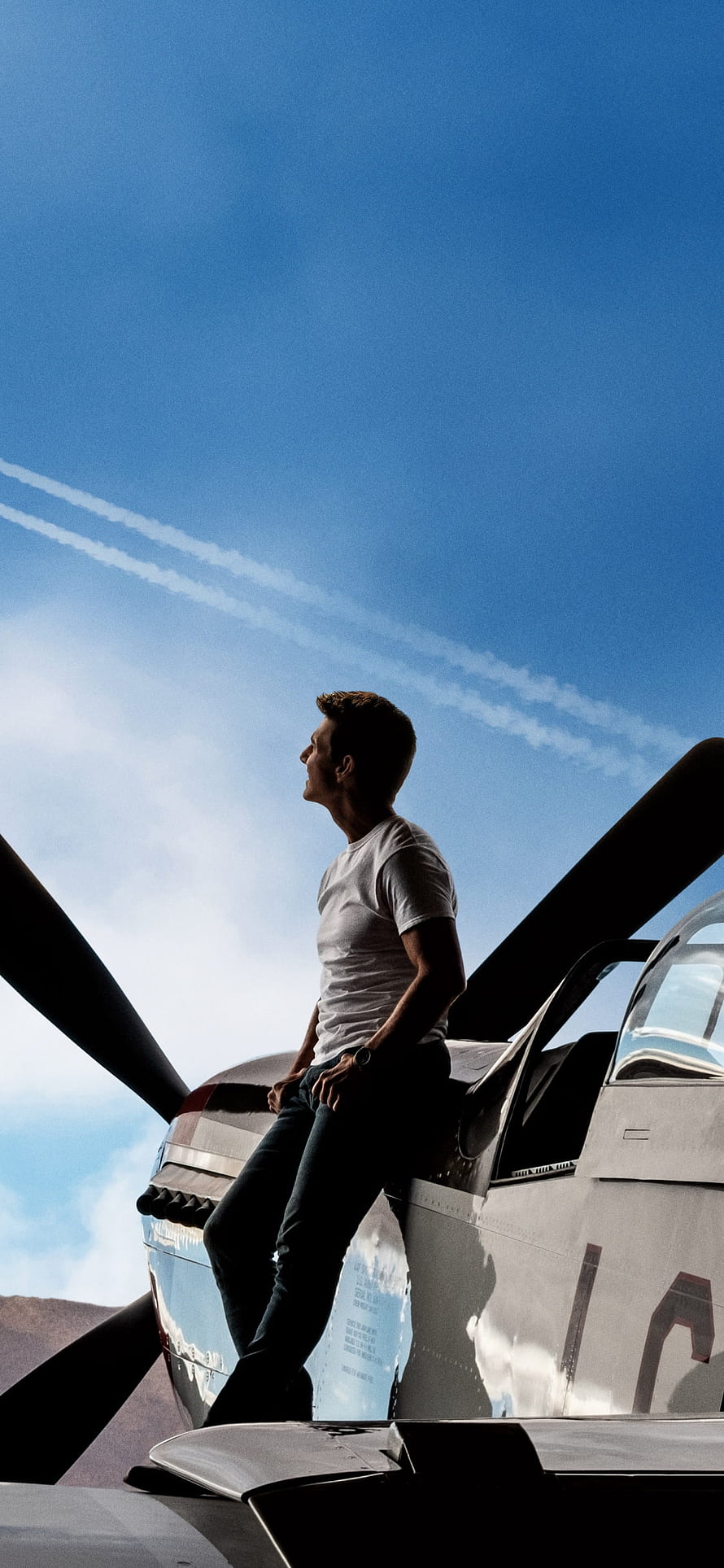 Tom Cruise as Maverick on a Propeller Plane in Top Gun Maverick HD phone wallpaper
