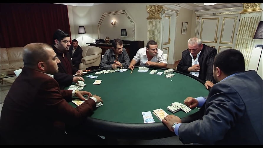 Kolpaçino Private Poker Game Scene with Men in Suits Around Green Felt Table HD wallpaper
