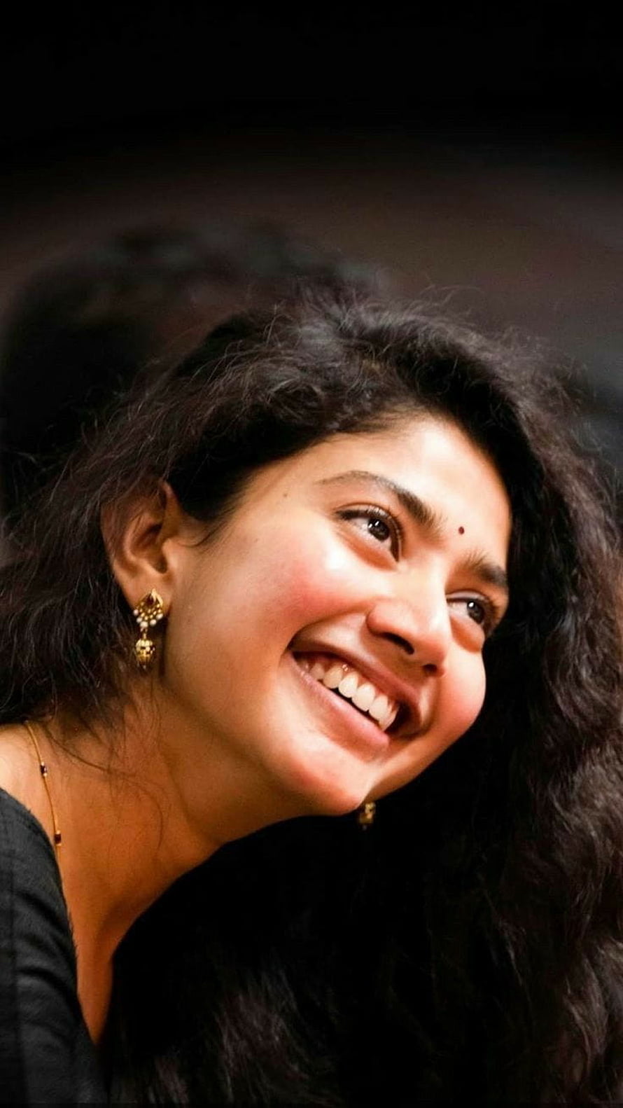 Sai Pallavi Smiling Portrait with Dark Wavy Hair and Gold Earrings HD phone wallpaper