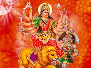 Goddess Durga Riding Lion with Multiple Arms and Weapons in Traditional Indian Art HD wallpaper