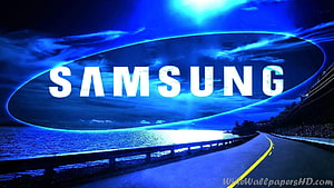 Samsung Logo Over Coastal Highway at Night with Blue Sky and Water Reflections HD wallpaper