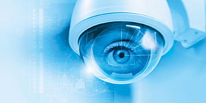 Blue Tinted CCTV Surveillance Camera with Human Eye and Digital Circuit Overlay HD wallpaper