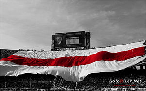 Giant River Plate Flag Unfurling Across Stadium Crowd in Dramatic Black and White HD wallpaper