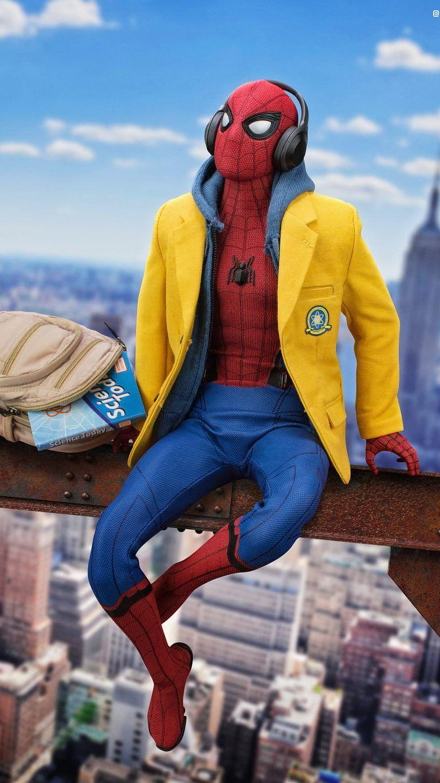 Spider-Man Homecoming School Uniform Figure Sitting on Rooftop Beam with Headphones and Backpack HD phone wallpaper