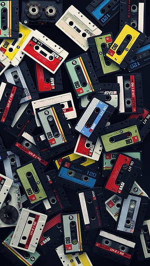 Retro 80s Audio Cassettes Scattered on Dark Background HD phone wallpaper