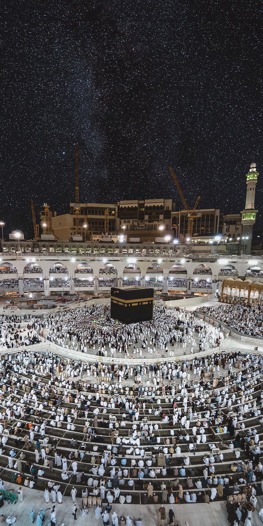 Kaaba at Night Under a Starry Sky with Pilgrims at Masjid al-Haram HD phone wallpaper