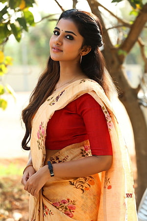 Anupama Parameswaran in a floral silk saree with a red blouse HD phone wallpaper