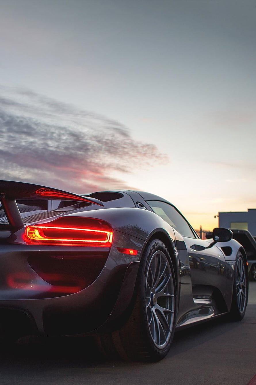 Porsche 918 Spyder Rear Three-Quarter View at Sunset with Glowing LED Taillights HD phone wallpaper