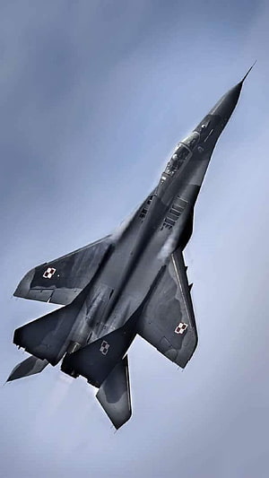 Polish Air Force MiG-29 Fulcrum Fighter Jet Climbing Through Blue Sky HD phone wallpaper