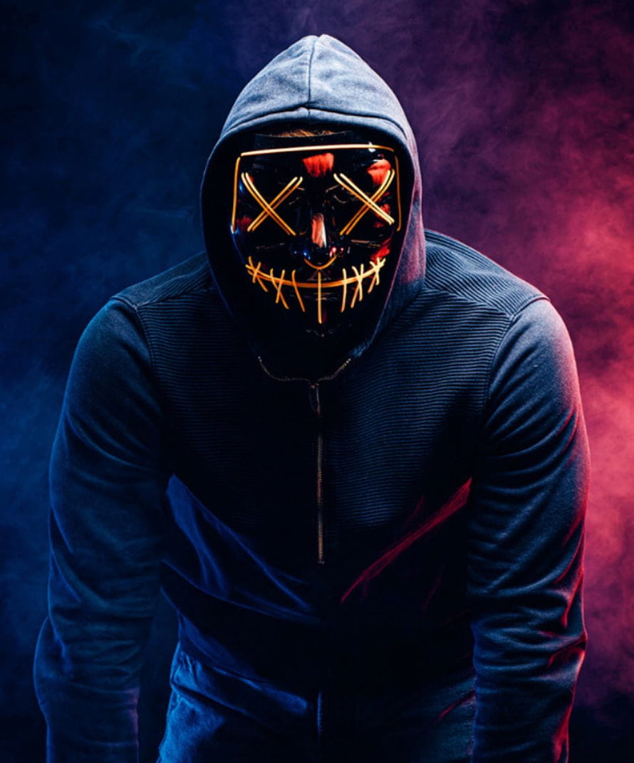 Hacker in Hoodie Wearing Glowing LED Mask with Neon Blue and Red Lighting HD phone wallpaper