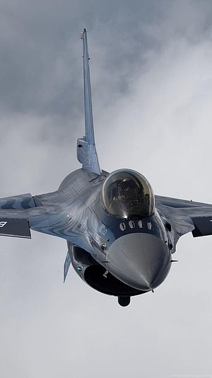 General Dynamics F-16 Fighting Falcon Jet Fighter in Flight Against Cloudy Sky HD phone wallpaper