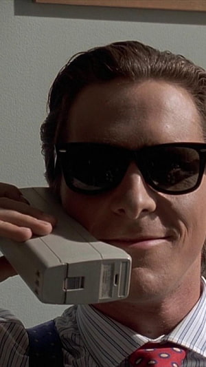 Patrick Bateman in Sunglasses Holding a Classic Brick Phone, patrick bateman HD phone wallpaper