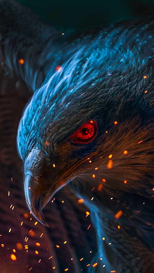 Close-up of a fierce eagle with glowing red eyes and floating embers HD phone wallpaper