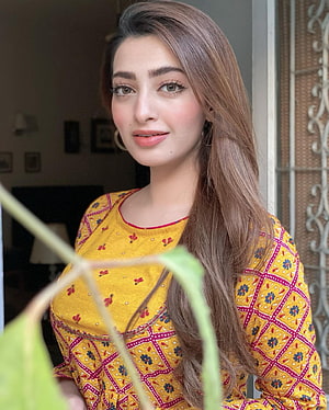 Nawal Saeed in a Vibrant Yellow Embroidered Kurta with Floral Patterns HD phone wallpaper