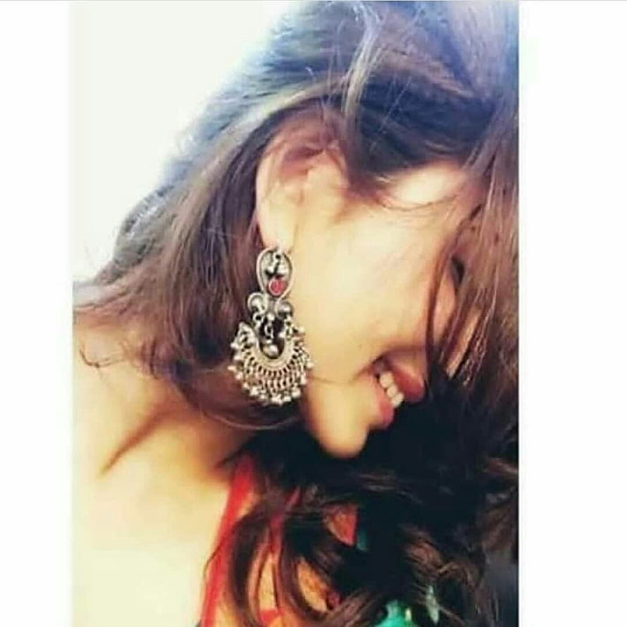 Smiling Woman With Long Wavy Hair Wearing Ornate Silver Jhumka Earrings HD phone wallpaper