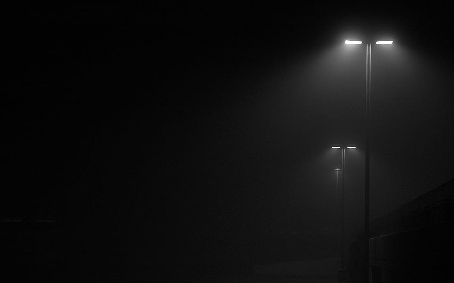Monochrome Street Lamps Illuminating a Thick Foggy Night Scene HD wallpaper