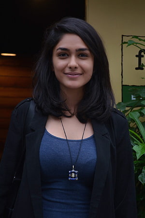 Mrunal Thakur Portrait in Black Blazer and Blue Top with Pendant Necklace HD phone wallpaper