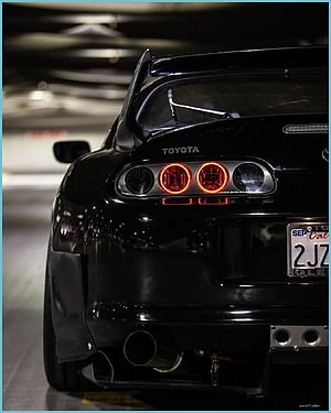 Rear View of a Black Toyota Supra MK4 with Custom Taillights and Carbon Fiber Spoiler HD phone wallpaper