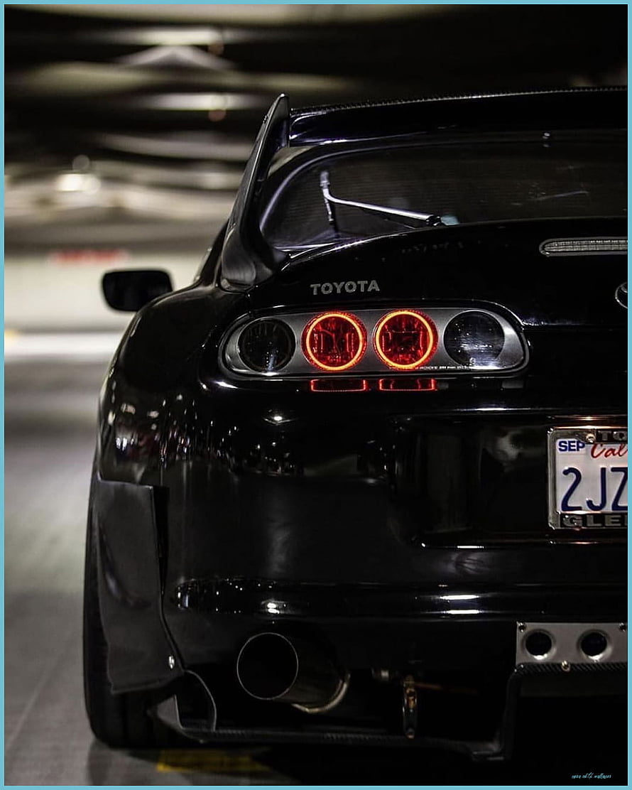 Rear View of a Black Toyota Supra MK4 with Custom Taillights and Carbon Fiber Spoiler HD phone wallpaper