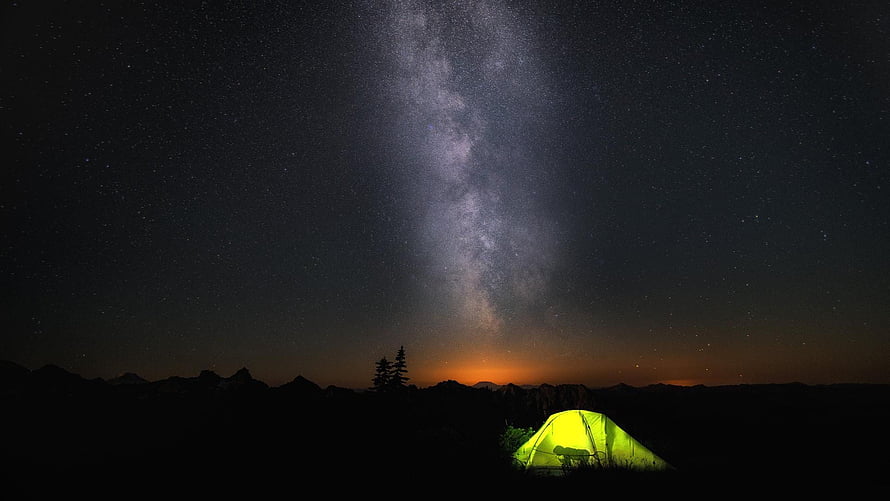 Glowing Tent Under the Milky Way During a Night Camping Adventure in the Mountains HD wallpaper