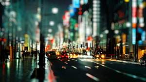 Rainy City Street at Night with Bokeh Lights and Traffic HD wallpaper